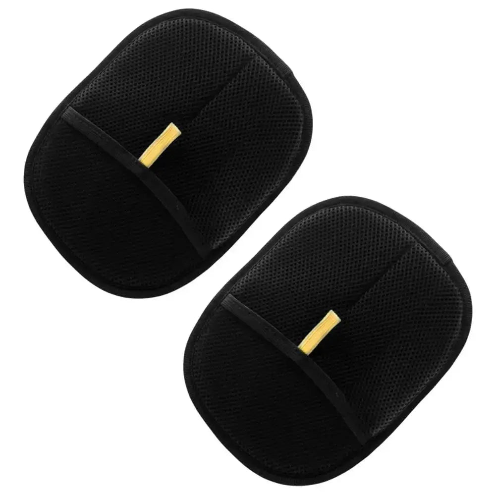 Two black cat hair removal gloves with gold accents on a white background