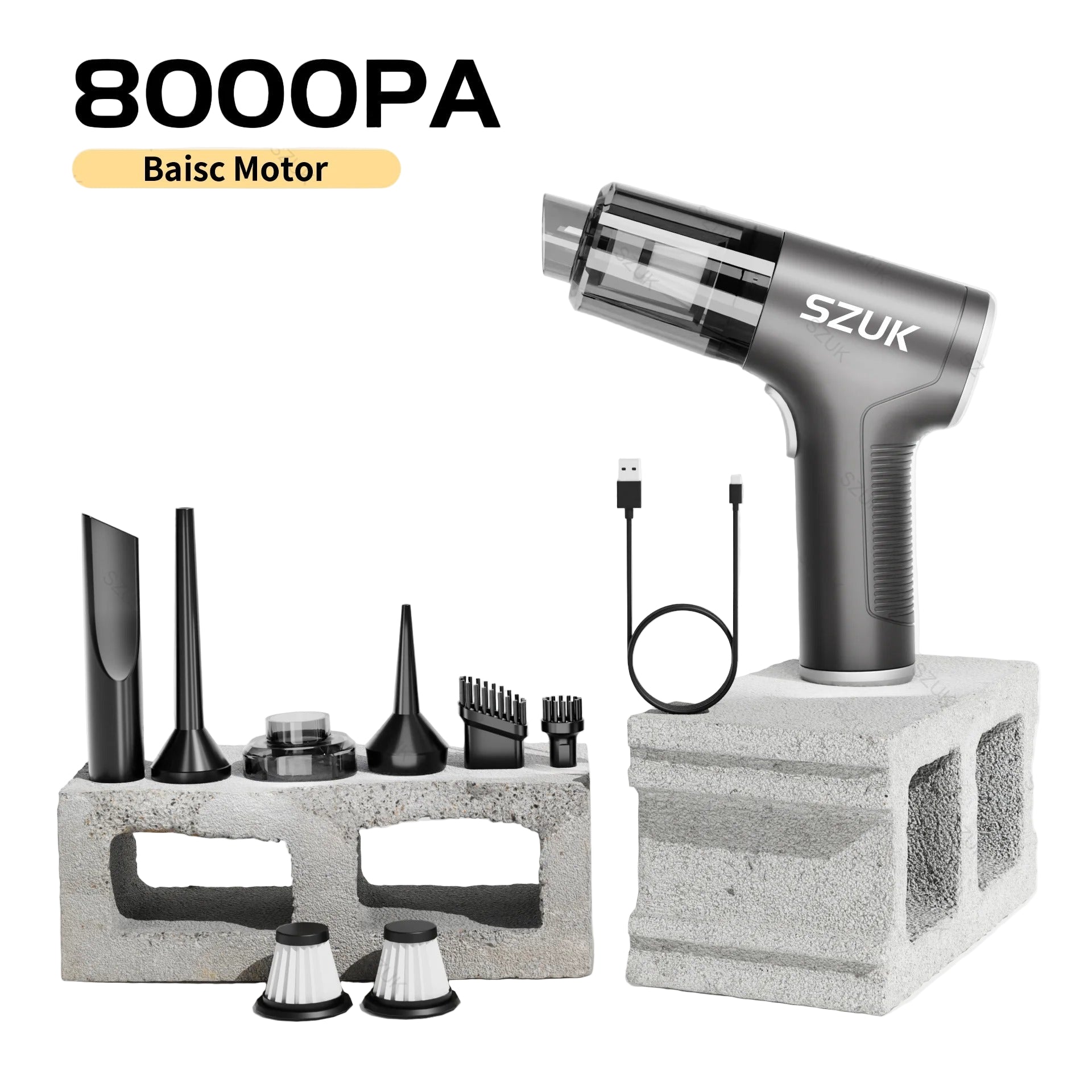 car mini vacuum cleaner with attachments on a concrete block against a light background
