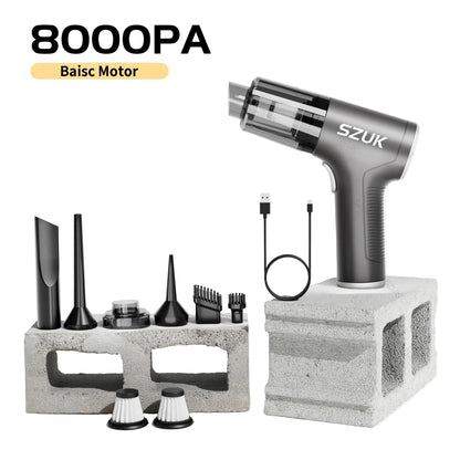 car mini vacuum cleaner with attachments on a concrete block against a light background