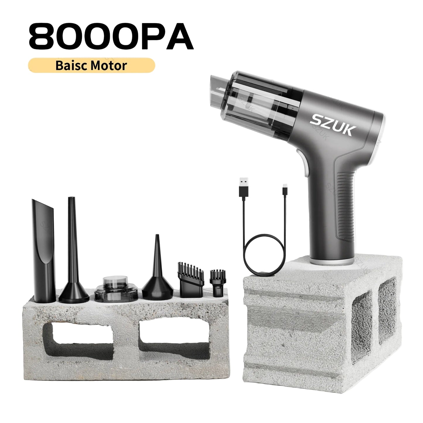 car mini vacuum cleaner with attachments on a concrete block against a light gray background