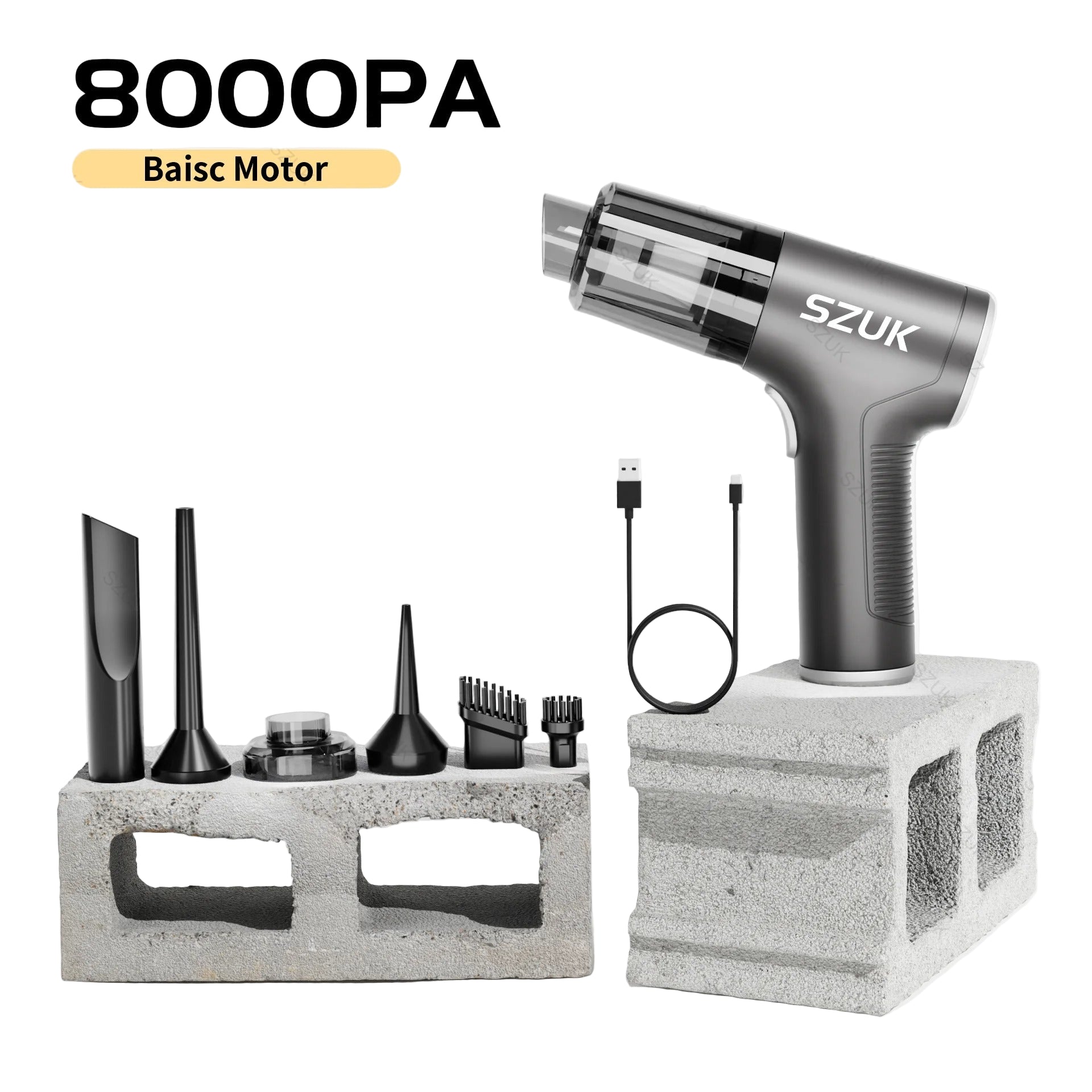 car mini vacuum cleaner with attachments on a concrete block against a light gray background